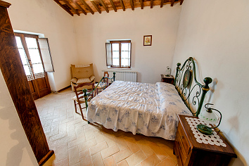 Room with double bed seen through the door